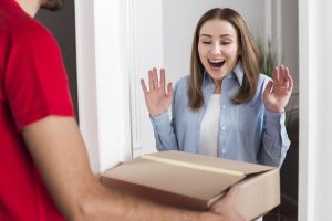 Front view woman being excited about her delivery package _ Premium Photo